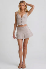 Low-Rise Pleated Mini Skirt in Ecru